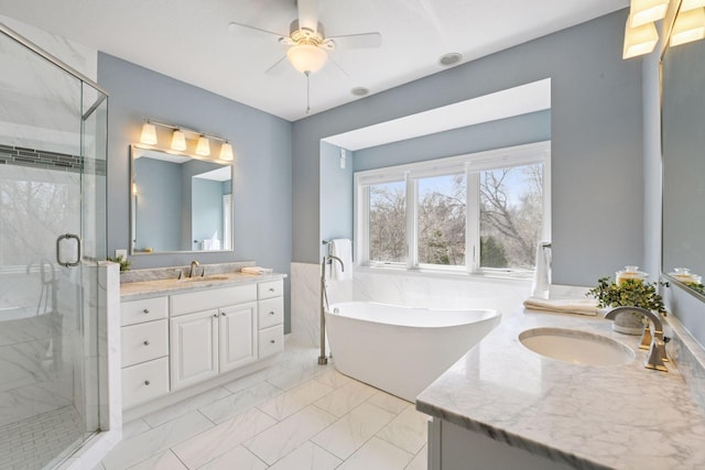 7604 Delaney Blvd, Edina, MN 55439 - bathroom featuring a stall shower, two vanities, a sink, and marble finish floor