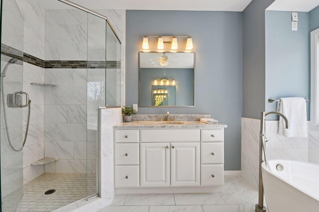 7604 Delaney Blvd, Edina, MN 55439 - full bathroom featuring a stall shower, marble finish floor, a freestanding tub, and vanity