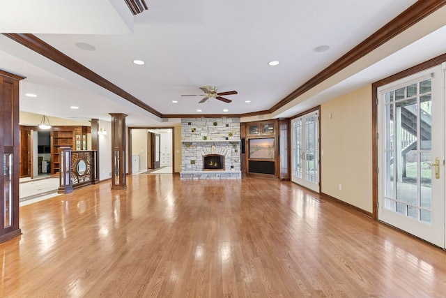 7604 Delaney Blvd, Edina, MN 55439 - unfurnished living room with light wood finished floors, a fireplace, ceiling fan, baseboards, and ornamental molding