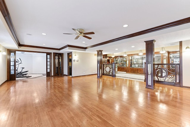 7604 Delaney Blvd, Edina, MN 55439 - unfurnished living room with ornate columns, a raised ceiling, crown molding, and baseboards