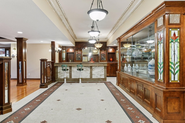 7604 Delaney Blvd, Edina, MN 55439 - interior space with crown molding, decorative columns, a community bar, and baseboards