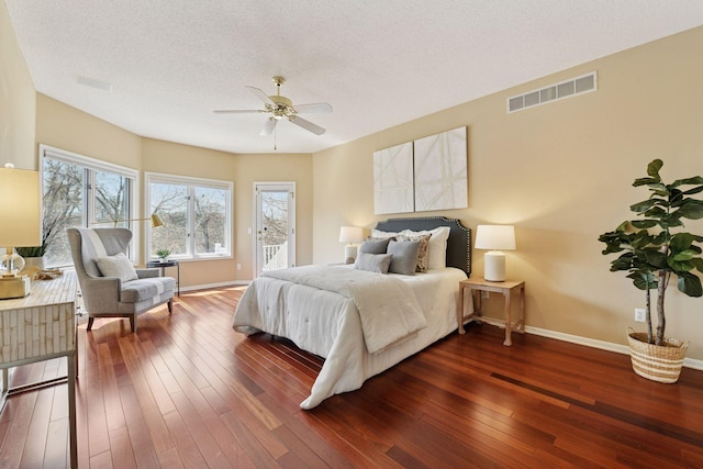 7604 Delaney Blvd, Edina, MN 55439 - bedroom featuring access to outside, dark wood-style floors, a ceiling fan, and a textured ceiling
