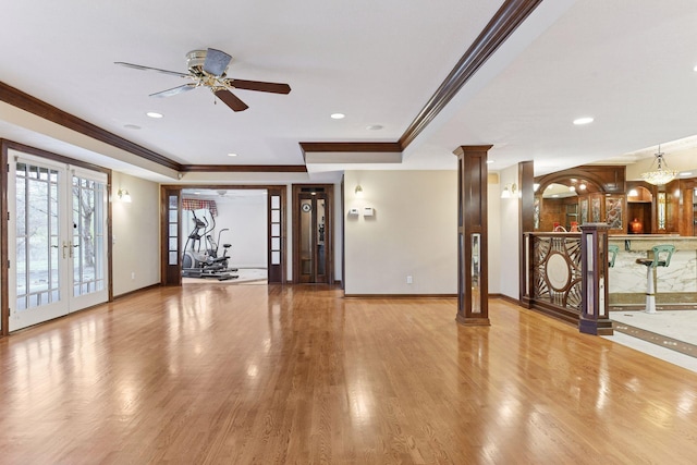 7604 Delaney Blvd, Edina, MN 55439 - unfurnished living room with crown molding, ornate columns, a ceiling fan, french doors, and wood finished floors