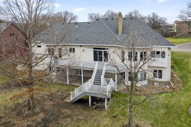 7604 Delaney Blvd, Edina, MN 55439 - rear view of house with a shingled roof, a chimney, stairs, stucco siding, and a yard