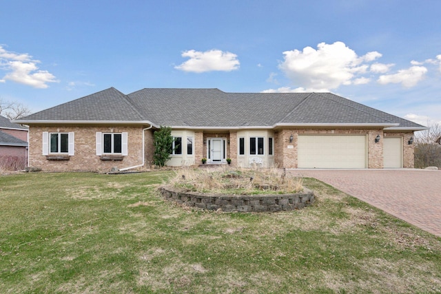 7604 Delaney Blvd, Edina, MN 55439 - view of front of house with brick siding, decorative driveway, an attached garage, a front lawn, and roof with shingles