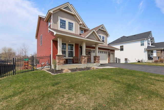 5836 Radford Ave NE, Otsego, MN 55374 - craftsman house featuring aphalt driveway, fence, board and batten siding, stone siding, and a garage