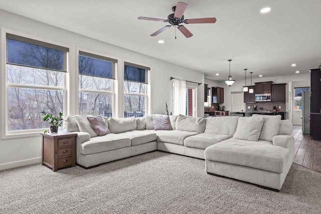 5836 Radford Ave NE, Otsego, MN 55374 - living room with a ceiling fan, baseboards, recessed lighting, and a healthy amount of sunlight