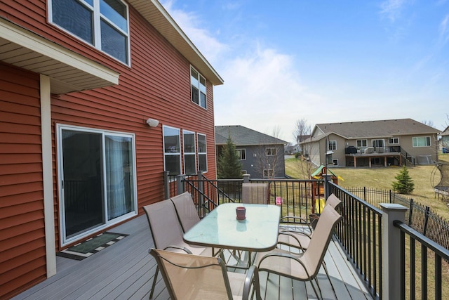 5836 Radford Ave NE, Otsego, MN 55374 - wooden terrace with a residential view, outdoor dining space, and fence