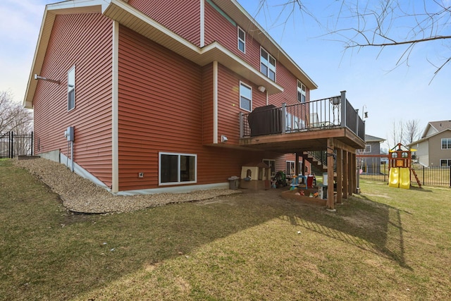 5836 Radford Ave NE, Otsego, MN 55374 - rear view of house with stairs, a playground, fence, a lawn, and a deck