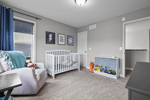 5836 Radford Ave NE, Otsego, MN 55374 - carpeted bedroom with a nursery area, a textured ceiling, and visible vents
