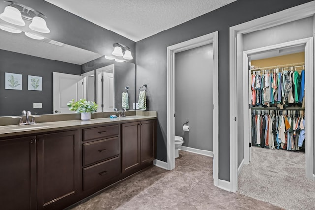 5836 Radford Ave NE, Otsego, MN 55374 - full bath featuring double vanity, toilet, baseboards, and a sink