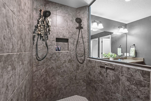 5836 Radford Ave NE, Otsego, MN 55374 - bathroom featuring vanity, a textured ceiling, and a tile shower