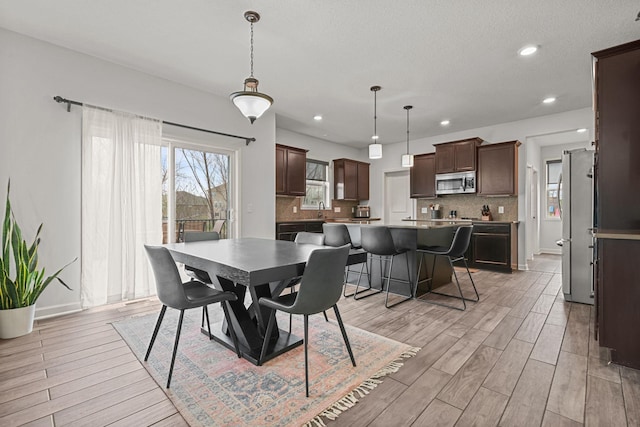5836 Radford Ave NE, Otsego, MN 55374 - dining area featuring baseboards, recessed lighting, and light wood-style floors