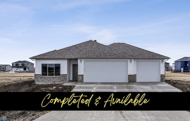 10218 73rd St S, Horace, ND 58047 - view of front of property with an attached garage, roof with shingles, and driveway