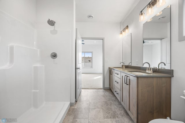 10218 73rd St S, Horace, ND 58047 - bathroom with ceiling fan, a sink, a shower, and double vanity