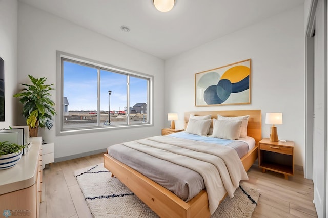 10218 73rd St S, Horace, ND 58047 - bedroom featuring baseboards and light wood-style floors