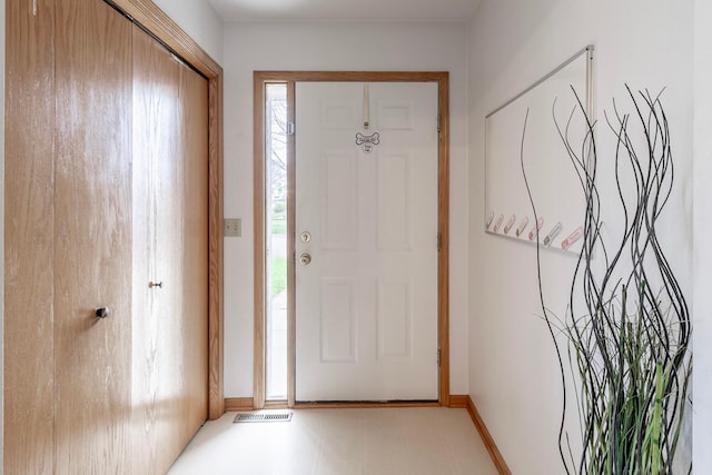 entrance foyer featuring baseboards