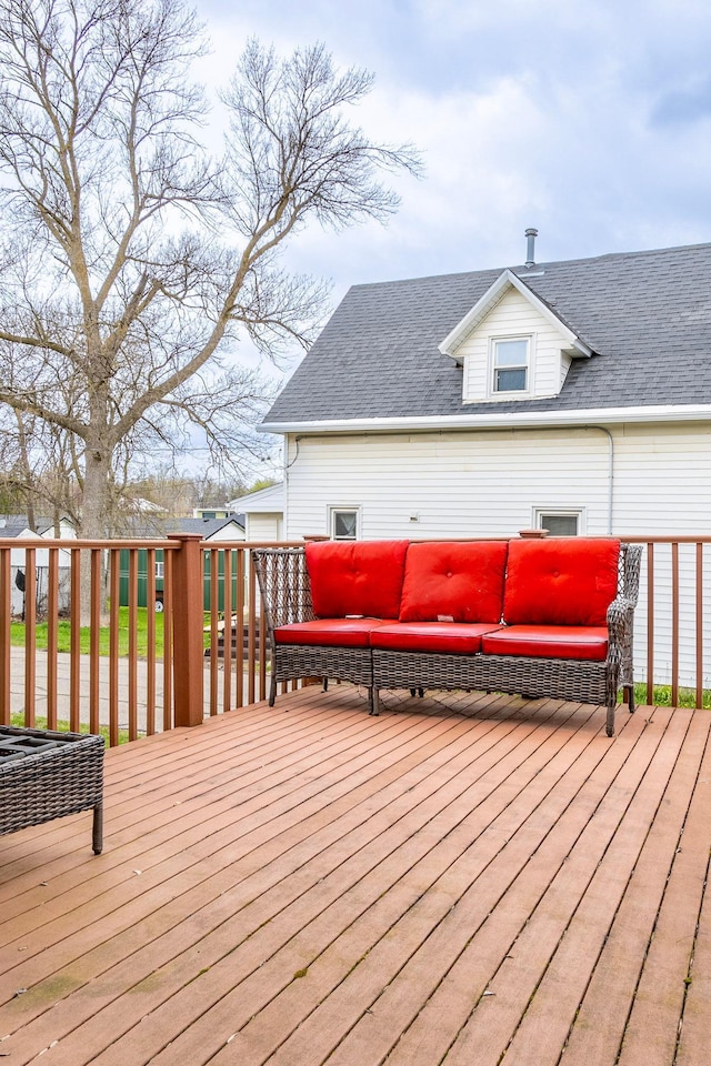 wooden terrace featuring an outdoor hangout area