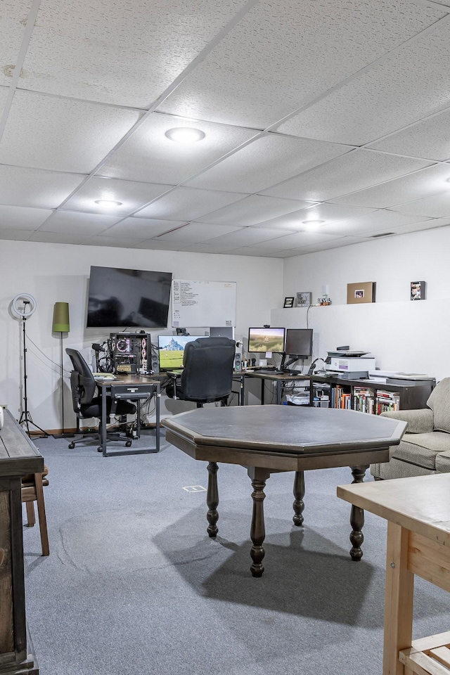 playroom featuring carpet flooring, a drop ceiling, and an office area