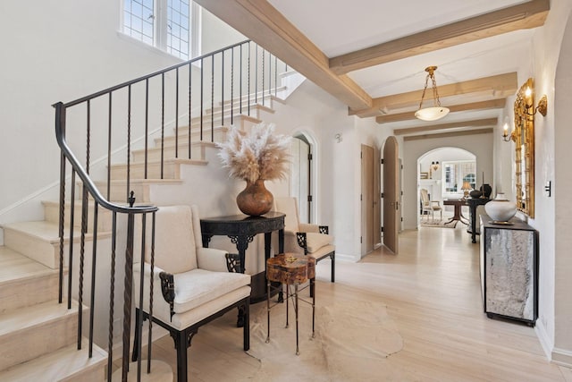 4232 Fremont Ave S, Minneapolis, MN 55409 - stairs with arched walkways, wood finished floors, beam ceiling, and healthy amount of natural light
