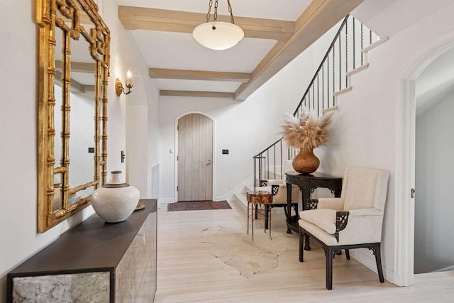 4232 Fremont Ave S, Minneapolis, MN 55409 - entryway featuring arched walkways, stairs, beamed ceiling, and wood finished floors
