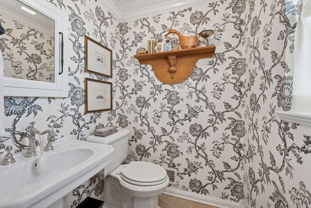 4232 Fremont Ave S, Minneapolis, MN 55409 - half bathroom featuring wallpapered walls and ornamental molding