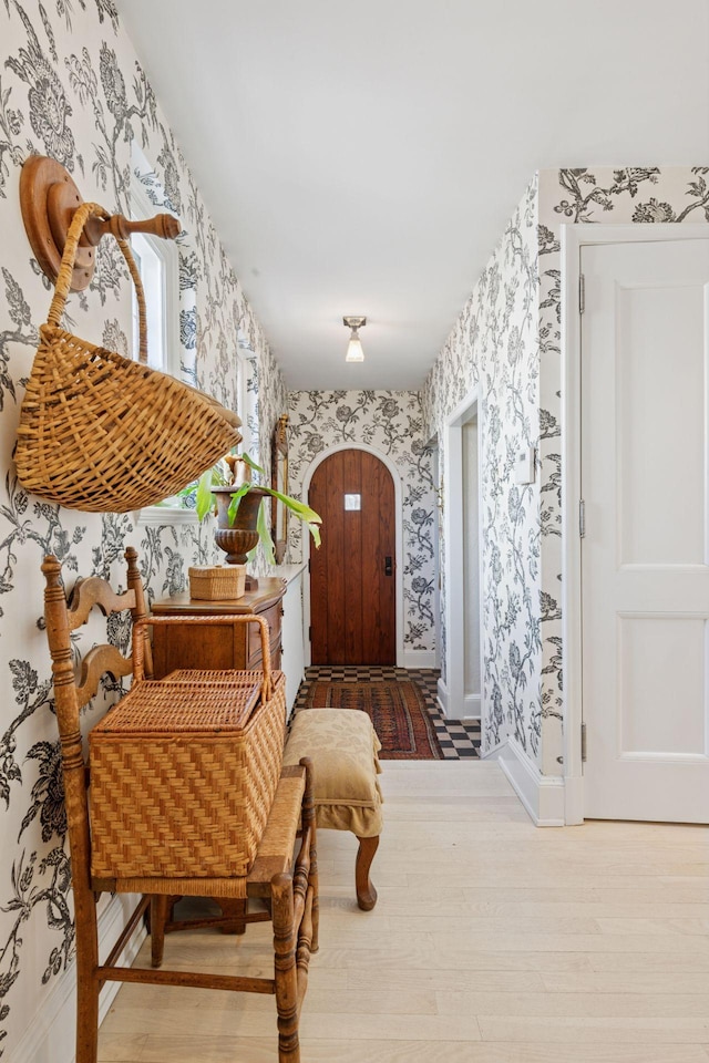 4232 Fremont Ave S, Minneapolis, MN 55409 - foyer featuring wallpapered walls, wood finished floors, and arched walkways