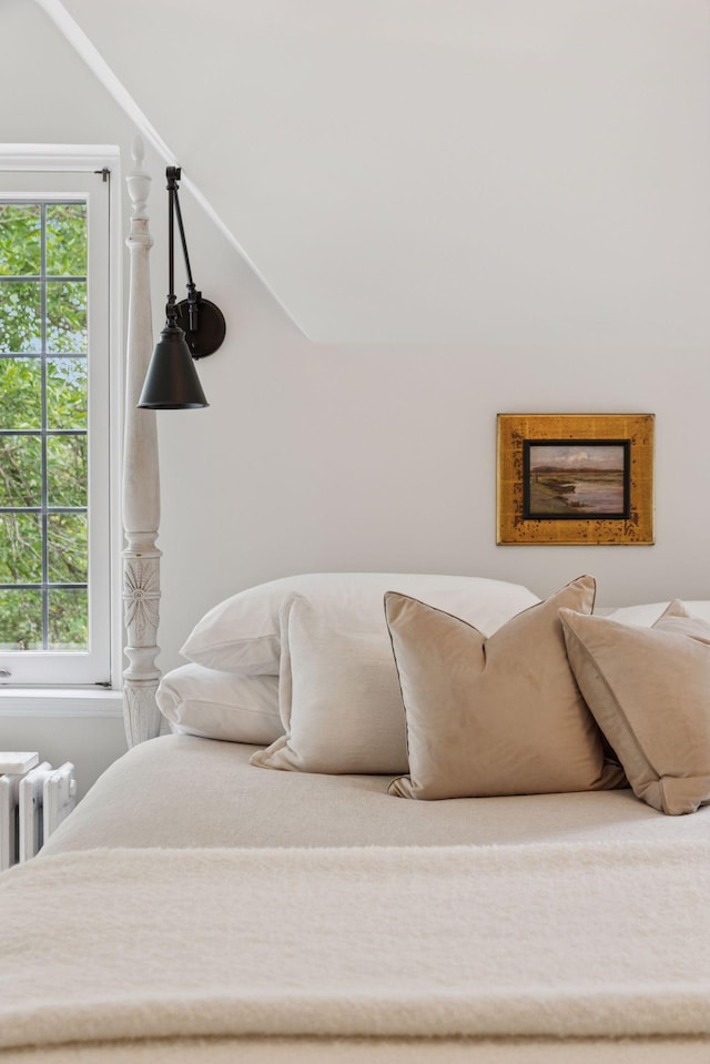 4232 Fremont Ave S, Minneapolis, MN 55409 - bedroom with multiple windows, radiator, and lofted ceiling