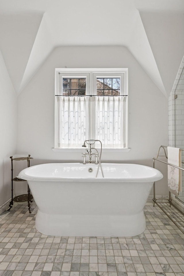 4232 Fremont Ave S, Minneapolis, MN 55409 - bathroom featuring vaulted ceiling and a freestanding tub