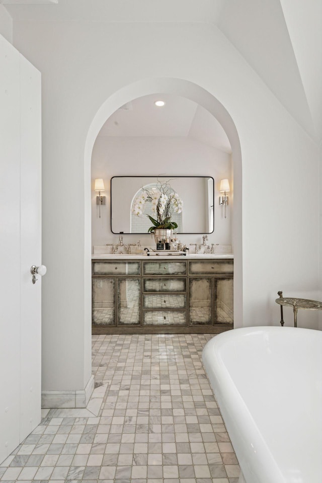 4232 Fremont Ave S, Minneapolis, MN 55409 - full bath with a soaking tub, double vanity, and lofted ceiling