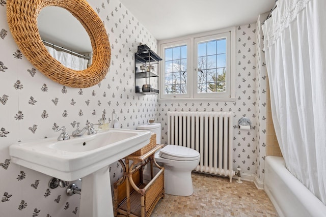 4232 Fremont Ave S, Minneapolis, MN 55409 - full bathroom featuring radiator heating unit, wallpapered walls, and shower / bath combination with curtain