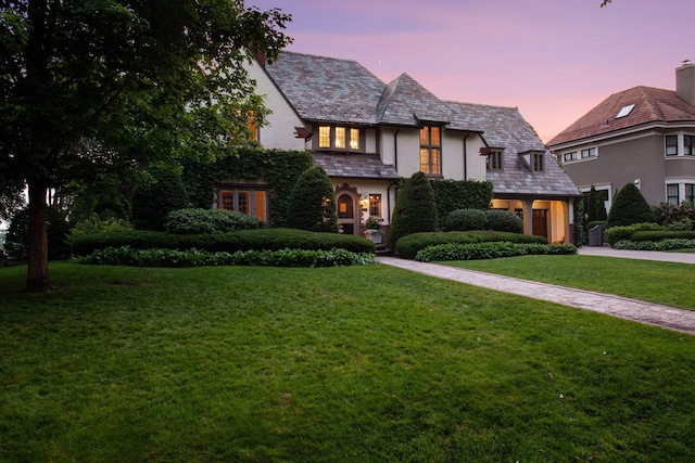 4232 Fremont Ave S, Minneapolis, MN 55409 - tudor home featuring a high end roof, a front yard, and stucco siding