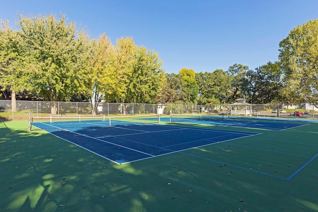 view of sport court with fence