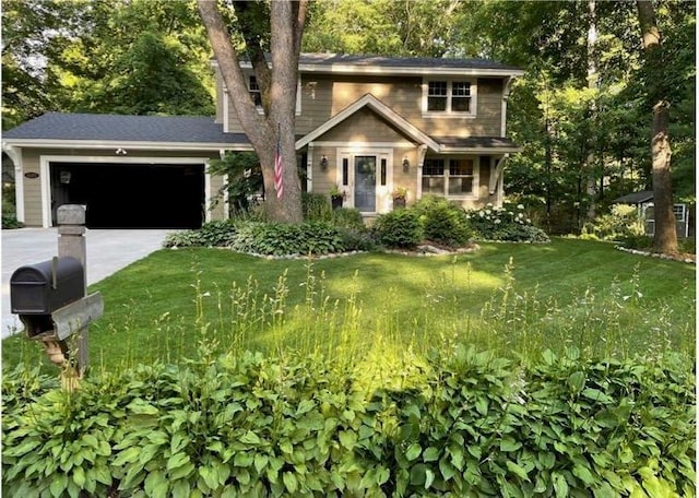 traditional-style home with an attached garage, concrete driveway, and a front lawn
