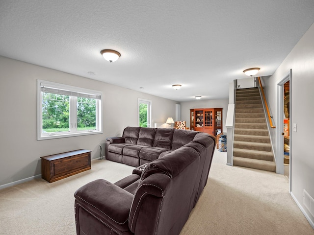26635 Variolite St NW, Stanford Twp, MN 55070 - living area featuring light carpet, stairs, and a textured ceiling