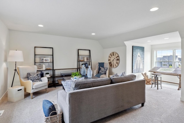 living area featuring light colored carpet, vaulted ceiling, and recessed lighting