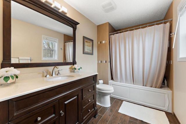 full bath with visible vents, wood finished floors, vanity, toilet, and shower / bathtub combination with curtain