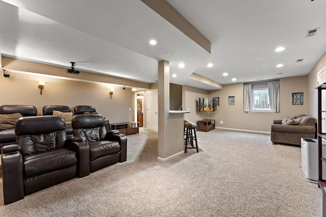 cinema room with visible vents, recessed lighting, baseboards, and light carpet