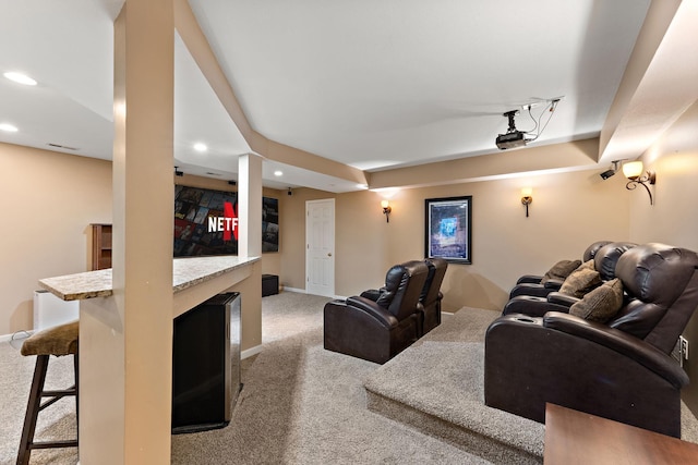home theater with carpet floors, baseboards, a fireplace, and recessed lighting
