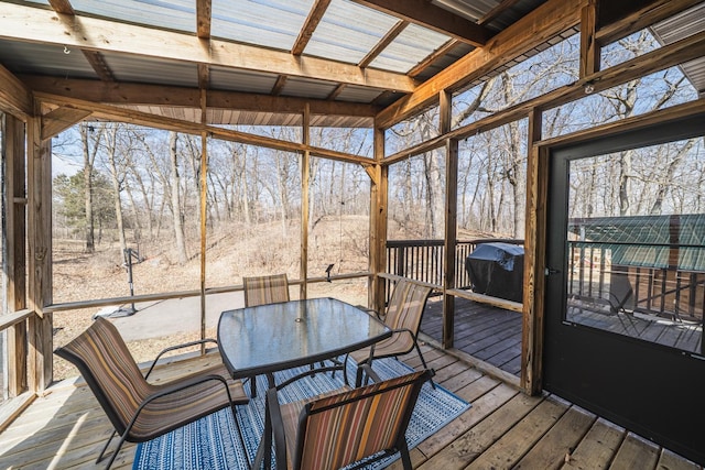 sunroom / solarium with outdoor dining area