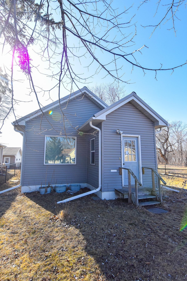 rear view of house with fence