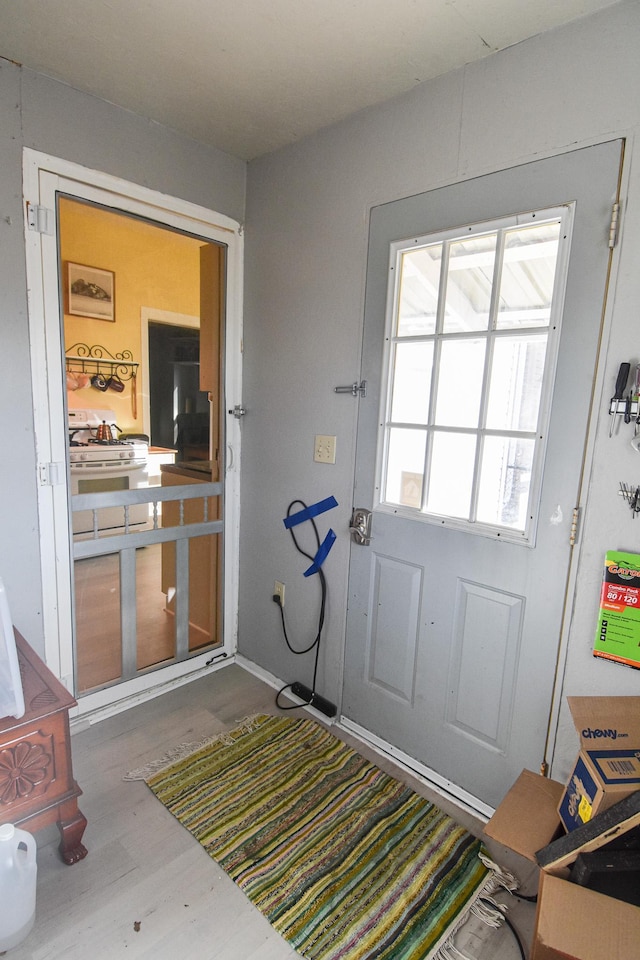 entryway with wood finished floors