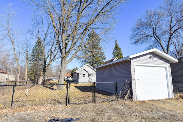 exterior space featuring dirt driveway, fence, and a gate