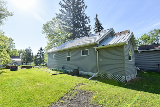 405 State Ave N, Thief River Falls, MN 56701 - view of side of home featuring metal roof and central AC
