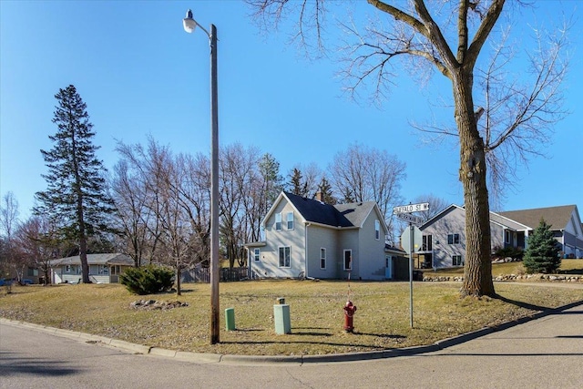 view of front facade with a front yard and a residential view