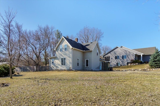 exterior space featuring a yard and fence