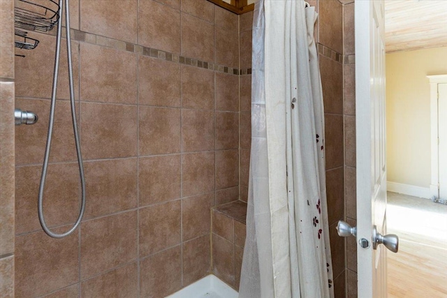 bathroom with a tile shower