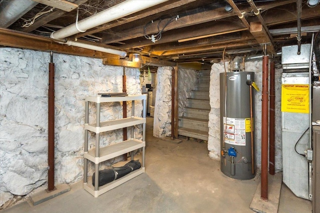 unfinished below grade area with water heater, stairway, and heating unit