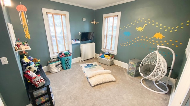 game room featuring baseboards, radiator heating unit, crown molding, and carpet flooring