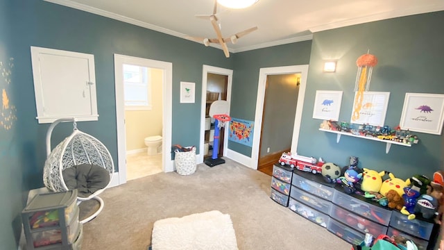 playroom featuring crown molding, baseboards, and carpet floors